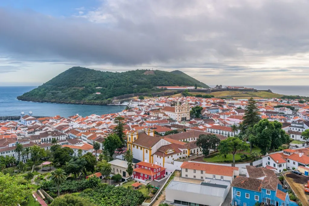view of Angra do Heroísmo from above with ocean visible in the distance