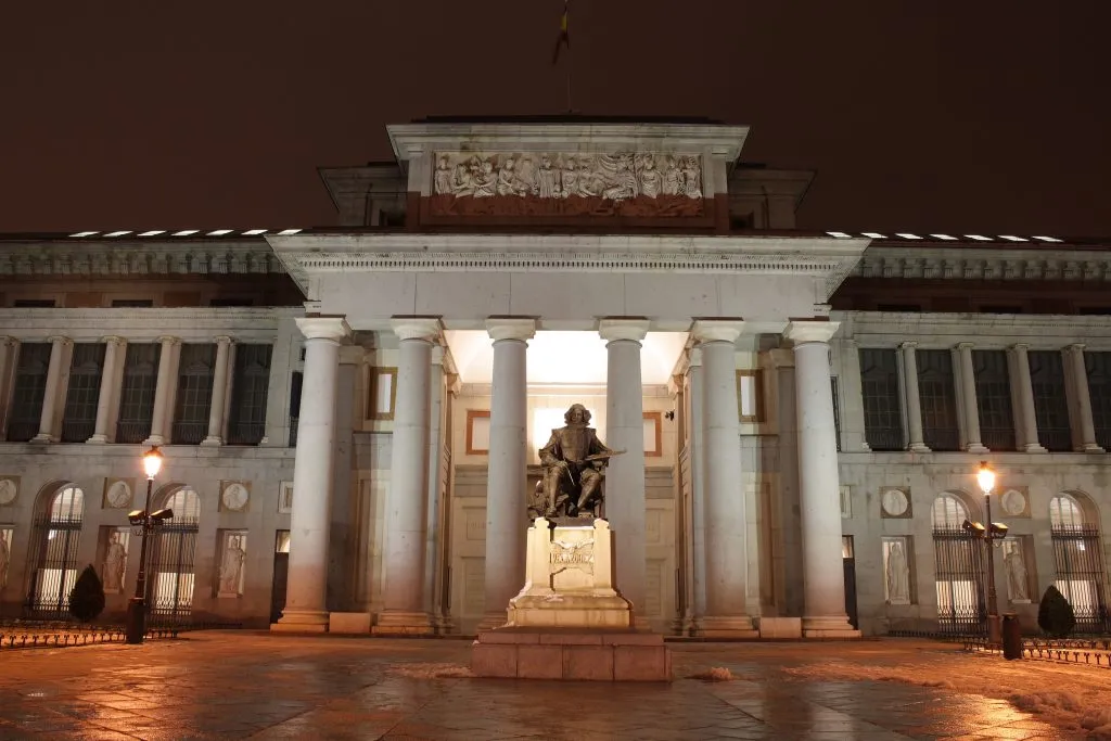 front facade of the prado museum madrid after dark