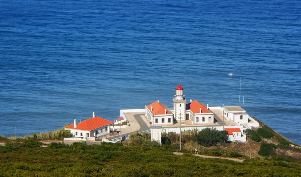 cape mondego lighthouse in figuiera da foz with sea in the background