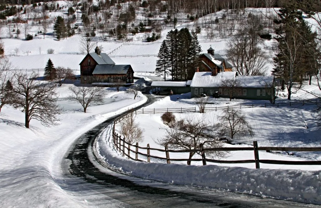 sleepy hollow farm near woodstock vermonth covered in snow, one of the best winter vacations in the us