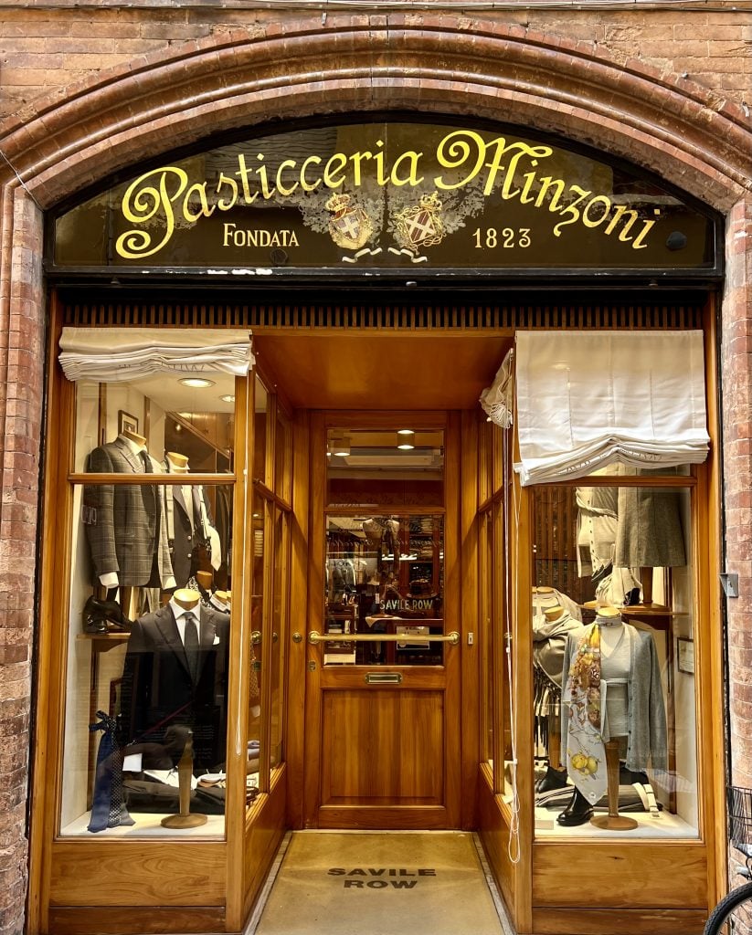 storefront in ravenna italy with suits in the windows