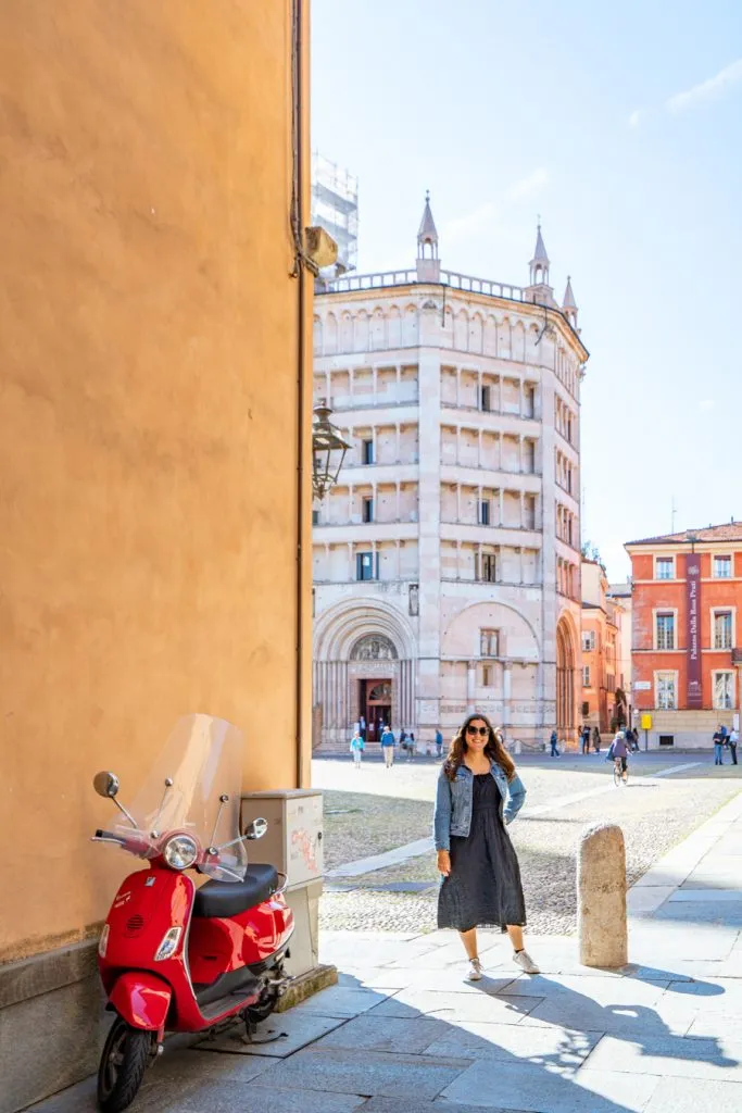 kate storm with a red vespa in parma italy