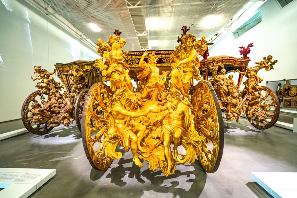 opulent gold covered royal carriage at the national coach museum, one of the top things to do belem portugal