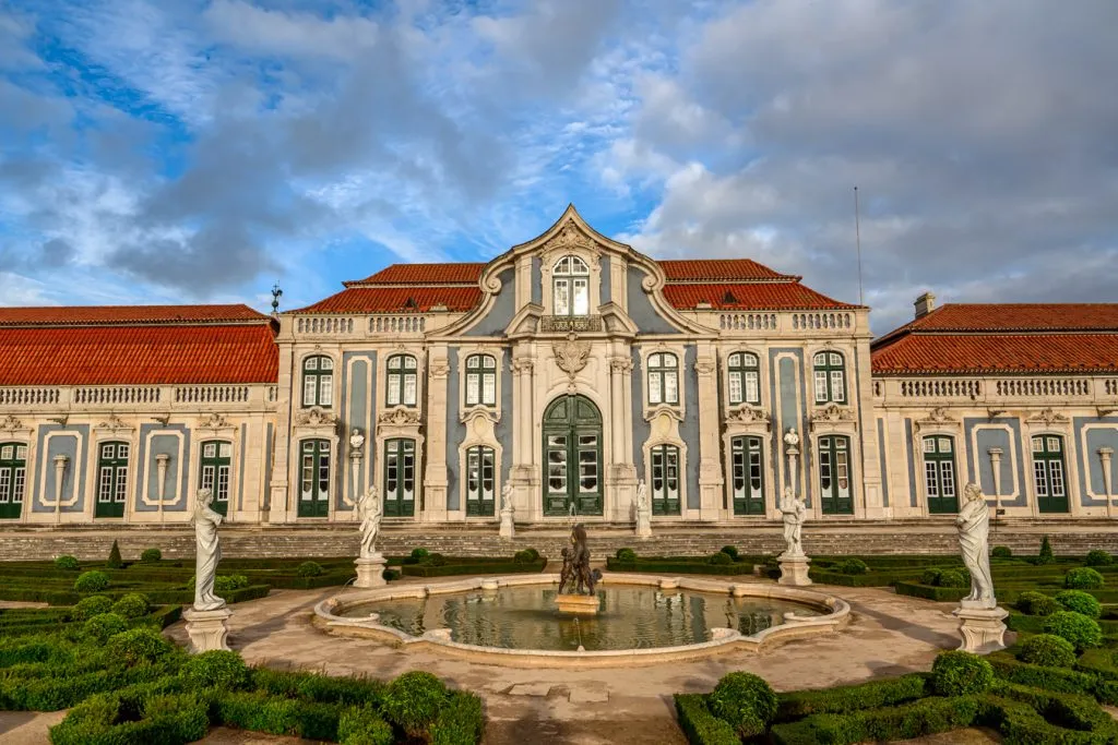 view of queluz national palace facade from the garden