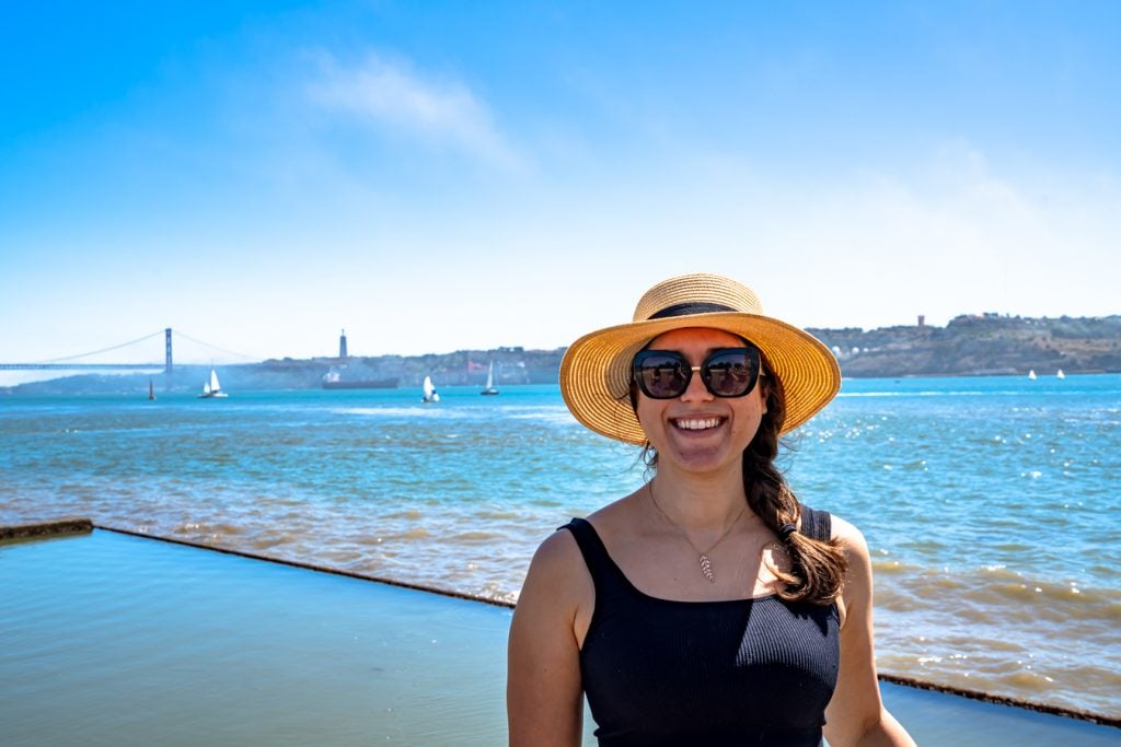 kate storm standing near the banks of the tagus river when visiting belem lisbon