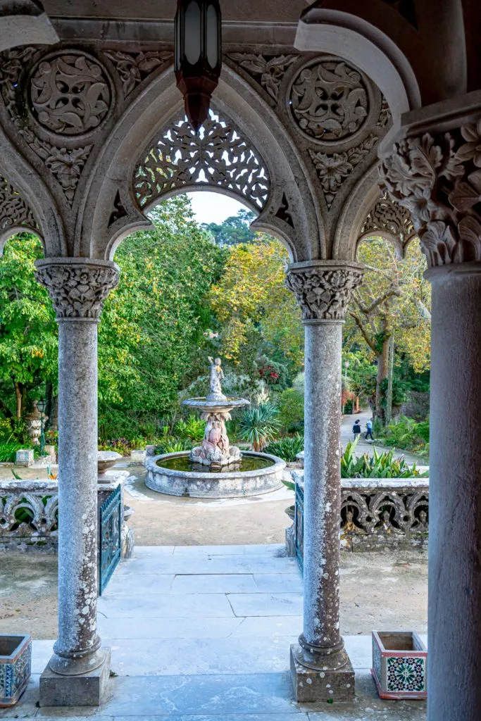 fountain seen through a porch frame at monserrate, one of the best things to do in sintra portugal