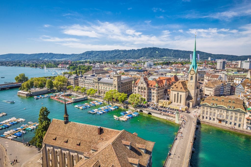 view of zurich switzerland from above in the summer, one of the best places to go in switzerland