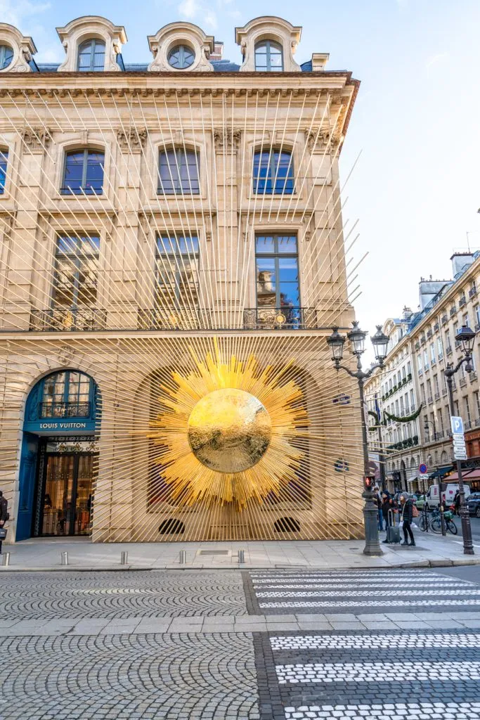 paris christmas decor in front of luxury store