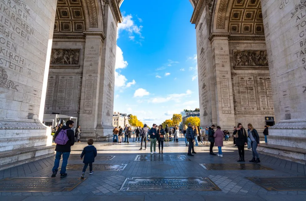 view under the arc de triomphe visiting paris france