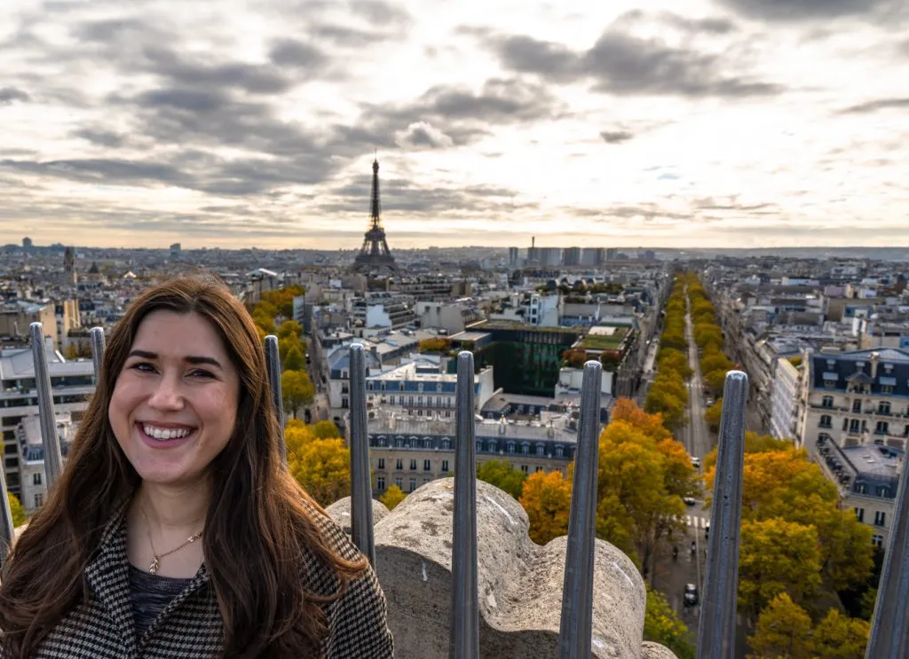 kate storm on the rooftop arc de triomphe paris france with eiffel tower visible in the distance