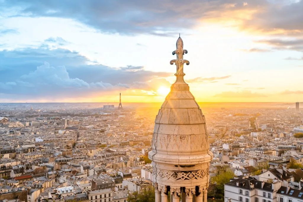 sunset from the top of sacre coeur with eiffel tower in the background