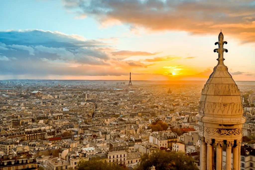 paris sunset as seen from top of sacre coeur with eiffel tower in center