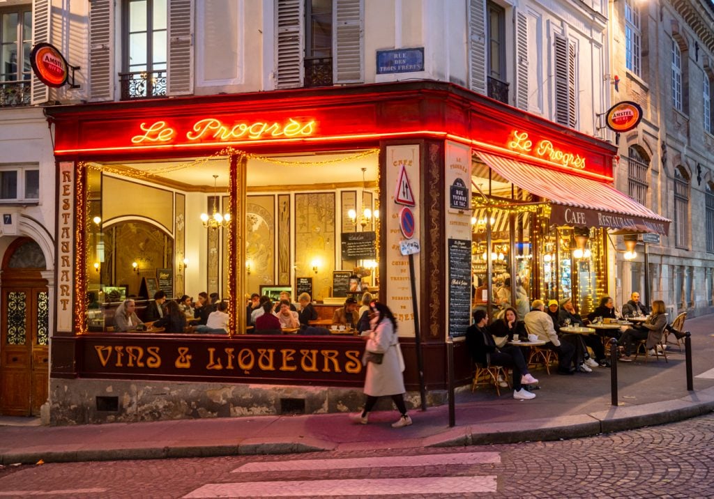 le progres cafe in montmartre at night