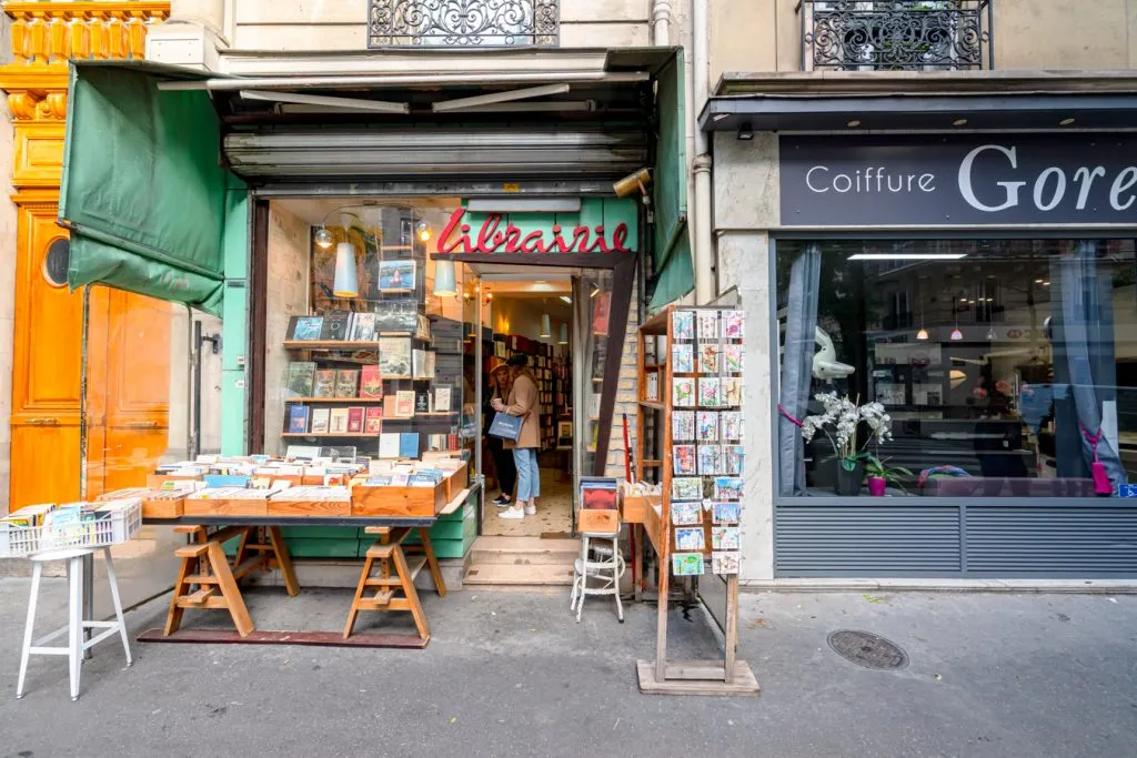 front facade of a small bookstore in montmartre paris france