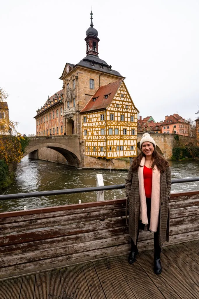 kate storm standing in front of bamberg old town hall, one of the best places to visit in bavaria in december