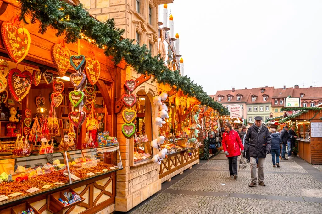 row of christmas market stalls in bamberg during advent, bavaria in december travel guide