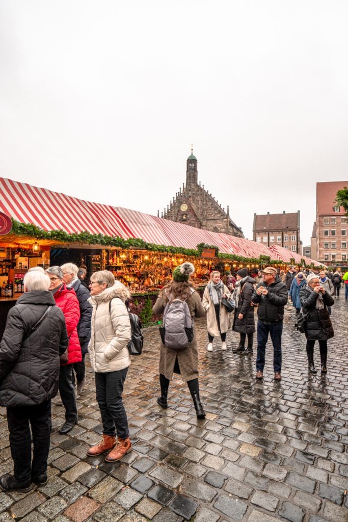 kate storm wearing a pacsafe backpack at a nuremberg christmas market