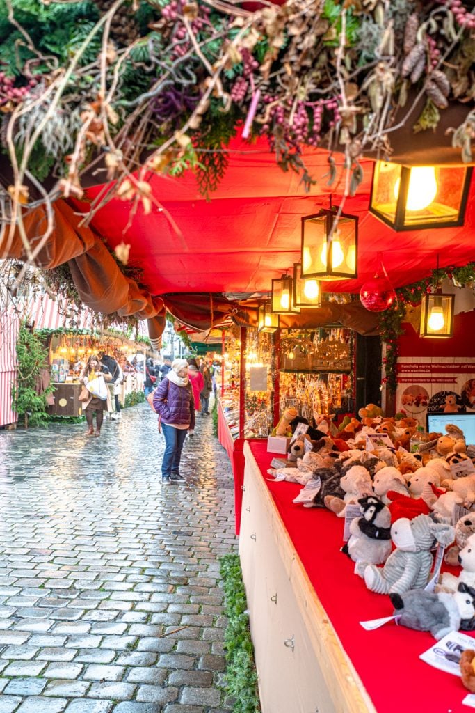 brightly lit christmas market stall in bavaria germany