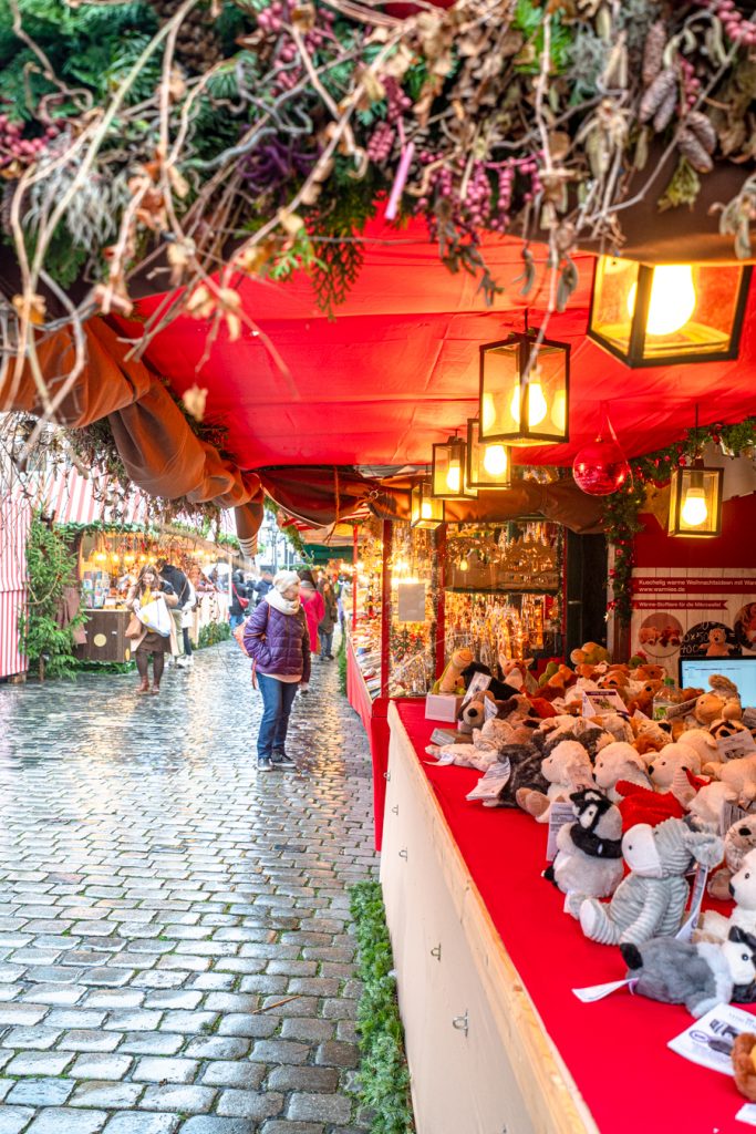 brightly lit christmas market stall in bavaria germany