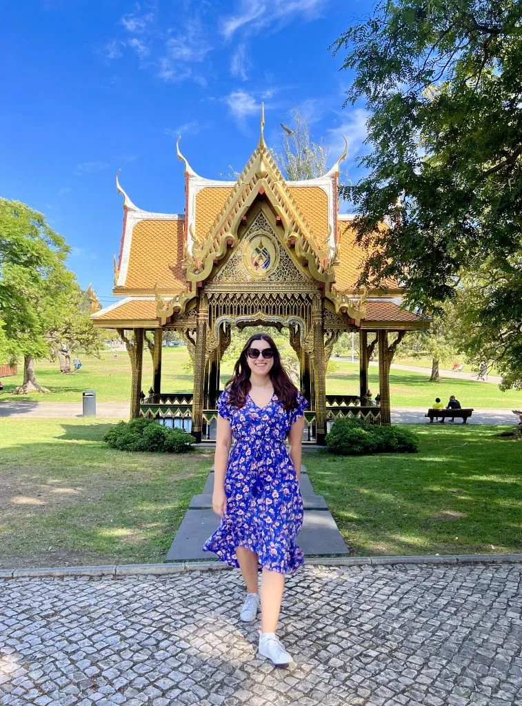 kate storm standing in front of thai pagoda when visiting belem lisbon portugal