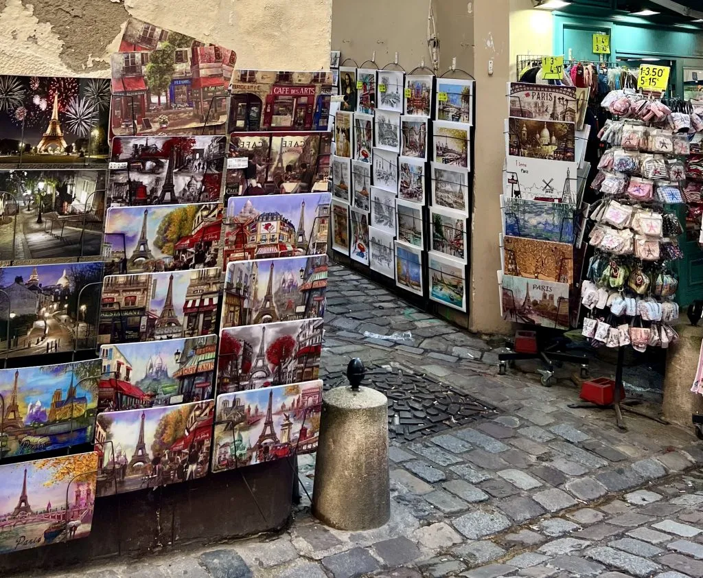 collection of placemats for sale at a souvenir shop in montmartre paris france