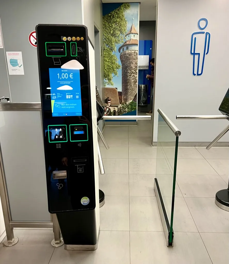turnstile entrance to public toilets in europe with a 1 euro pay to use toilets europe fee attached