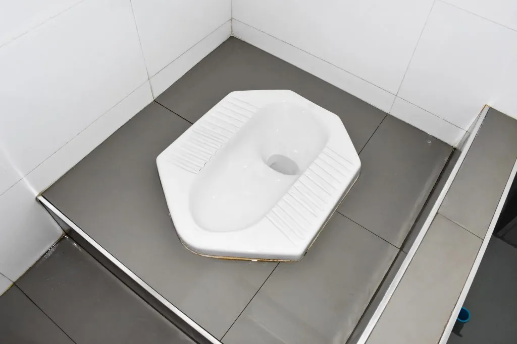 a clean squat toilet photographed from above