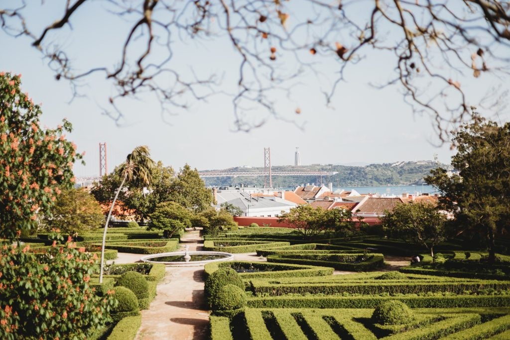 view of ponte 25 de abril bridge with botanical garden in the foreground