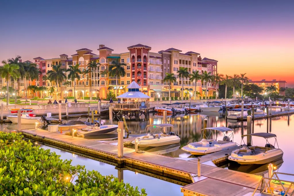 harbor and buildings at sunset in naples florida, one of the best summer vacation destinations in usa