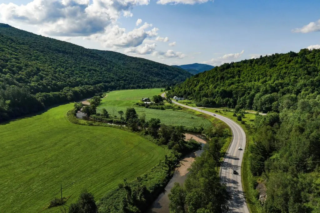 aerial view of curving road in vermont during a summer trip in america