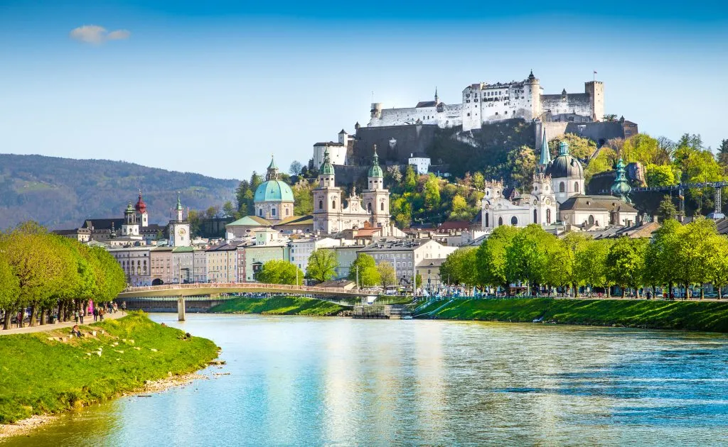 salzburg austria with river in the foreground and castle in the background. one of the most romantic cities in europe