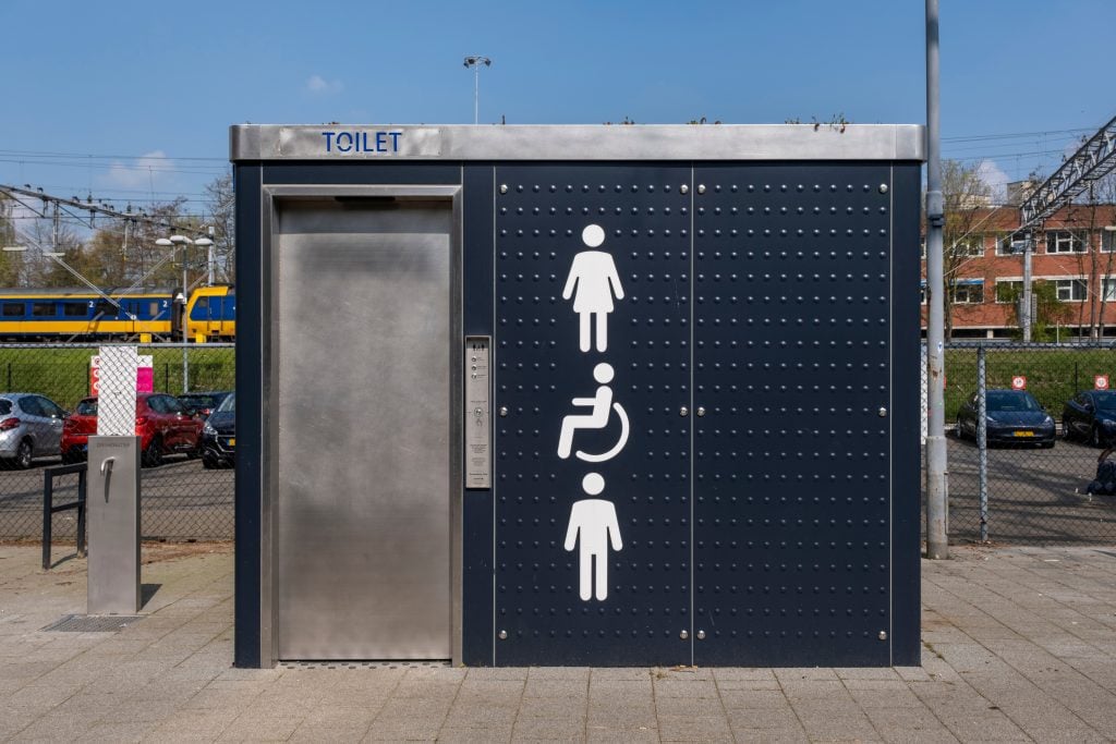 front facade of a bank of public toilets in europe