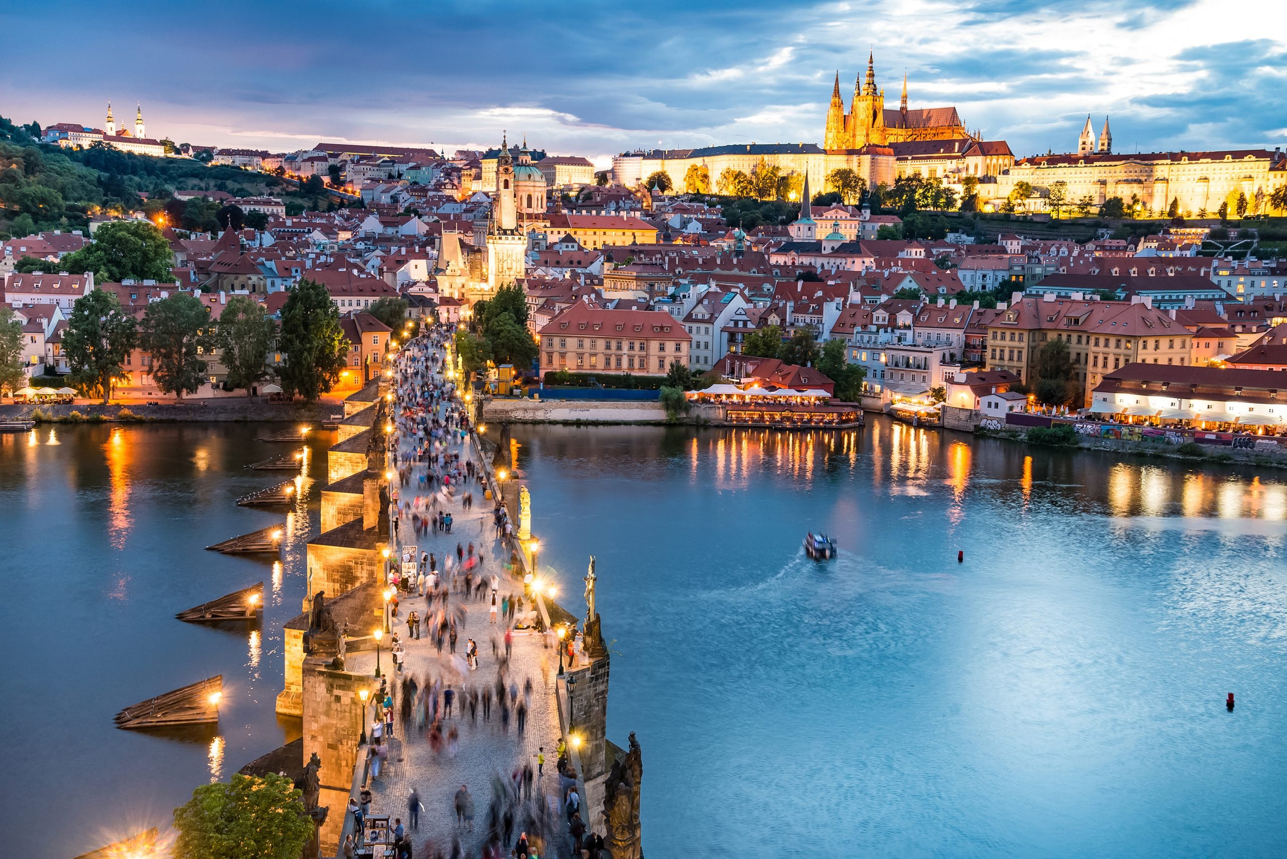 sunset over the charles river from above with prague castle in the background, beautiful view of prague, one of the most romantic cities in europe