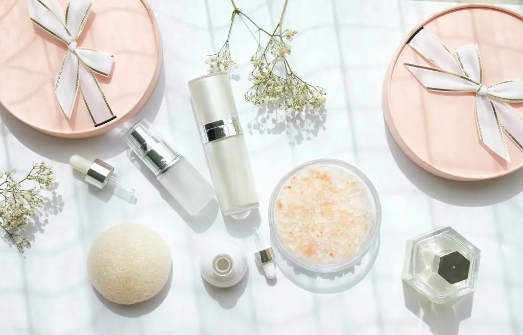 flatlay of beauty and skincare products, some of the best paris souvenirs to shop for