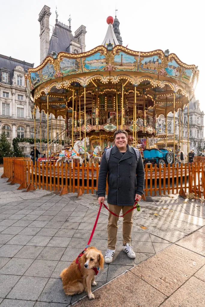 jeremy storm and ranger storm in front of hotel de ville carousel at paris christmas market