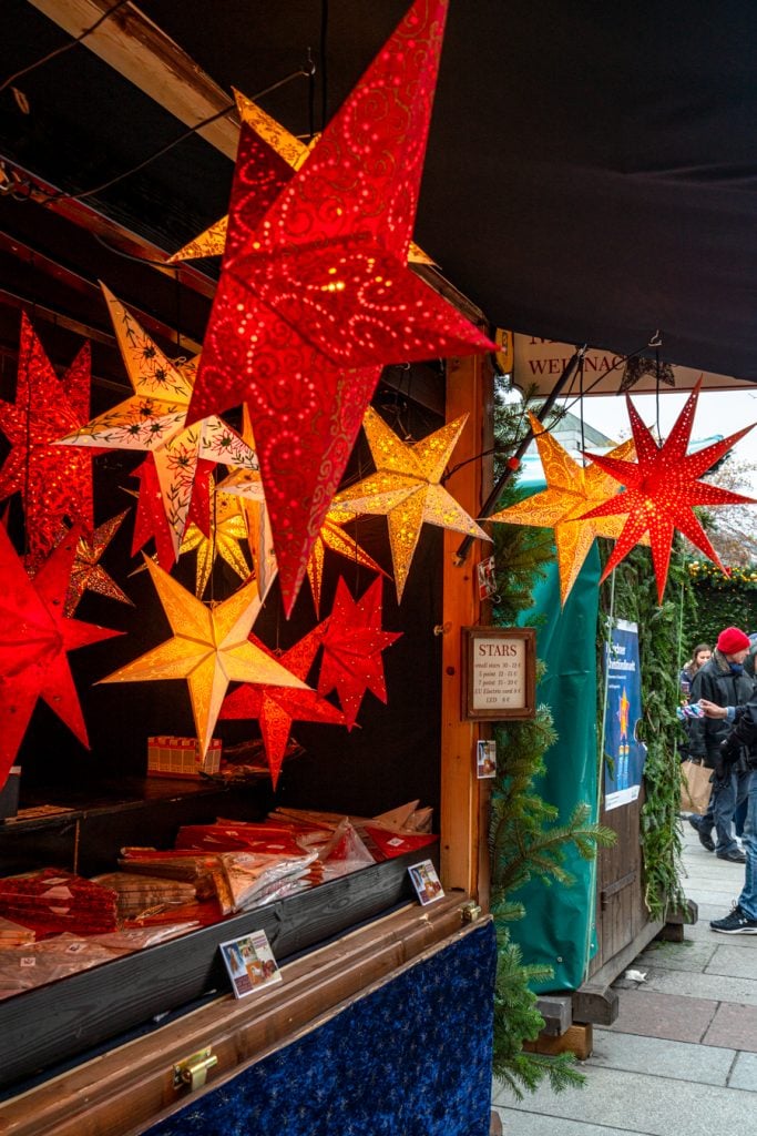 paper lanterns for sale at a munich christmas market during a trip to bavaria in winter