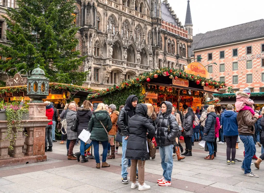 crowds of visitors enjoying a munich christmas market