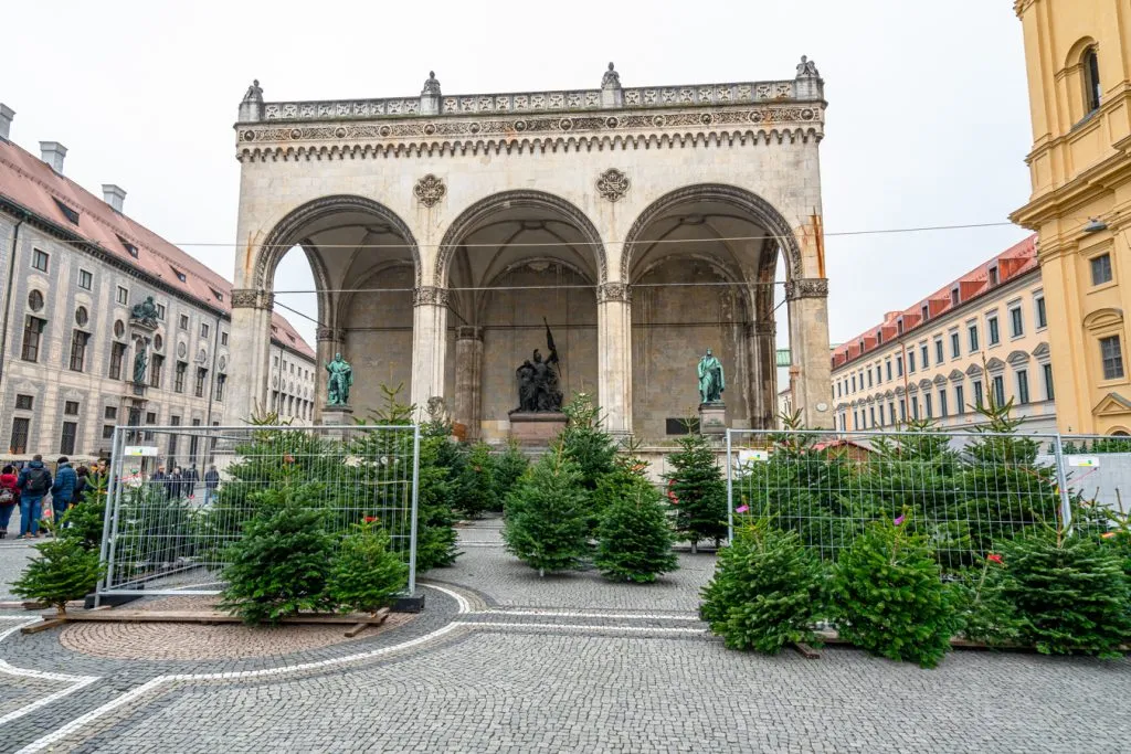 Feldherrnhalle in odeonsplatz during a day in munich itinerary with christmas trees for sale out front