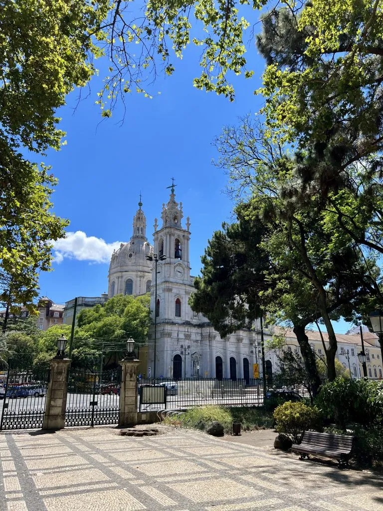 basilica da estrela as seen from estrela garden on a sunny day