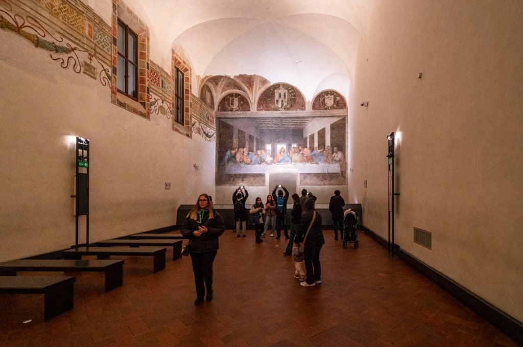 view from the last supper from across the room as visitors approach