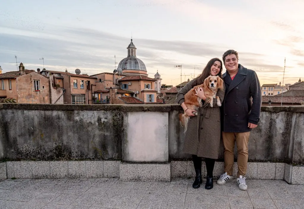 kate storm jeremy storm and ranger storm on a roofdeck of rome at sunset during an itinerary rome italy