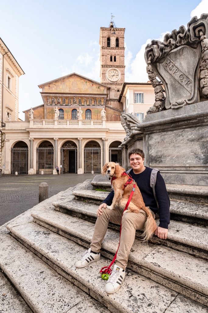 jeremy storm and ranger storm sitting in piazza di santa maria in trastevere rome, one of the best squares in rome italy
