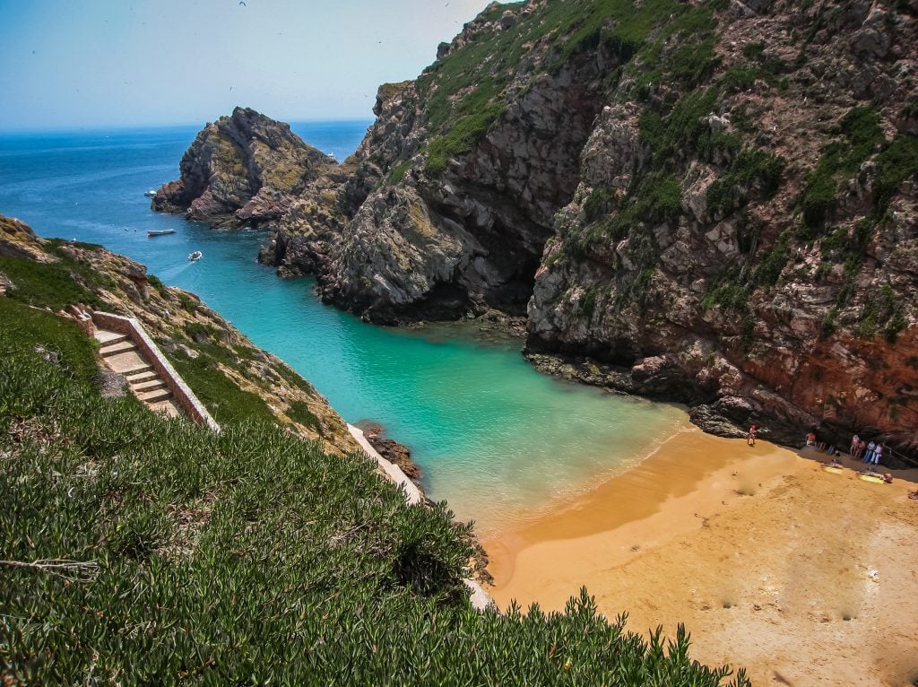 pcituresque beach with bright blue water on berlenga island, one of the most unique lisbon day trip ideas