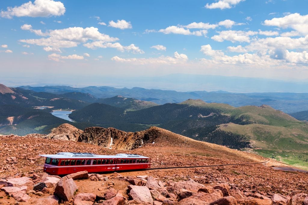 bright red pikes peak cog railway in colorado