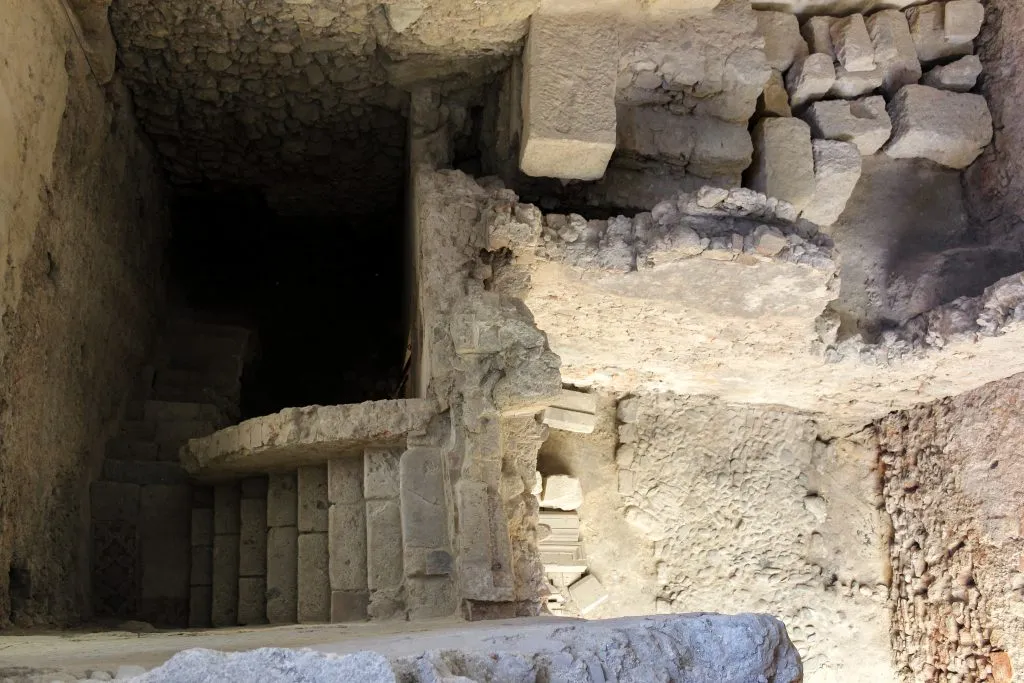 ruins of a roman theatre in lisbon portugal as seen from above, one of the secret lisbon spots to visit