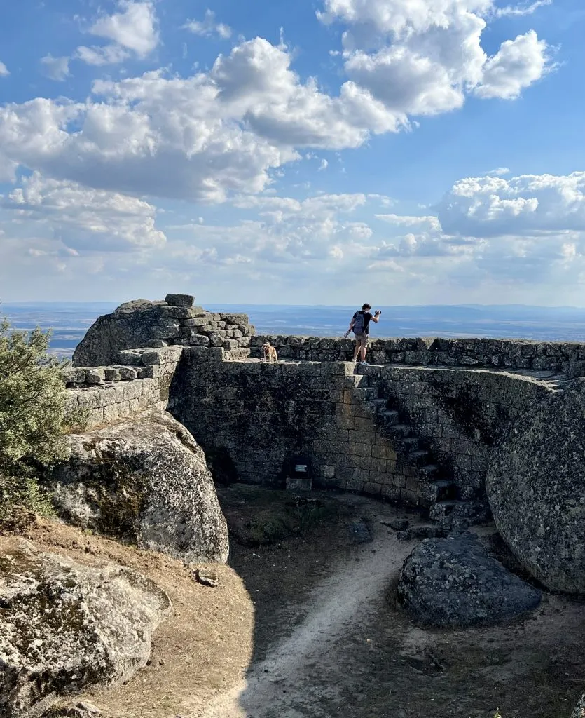 jeremy storm and ranger storm on top of a castle wall one of the best places to visit in monsanto portugal