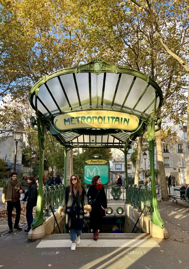 glass covered entrance of abbesses metro stop montmartre
