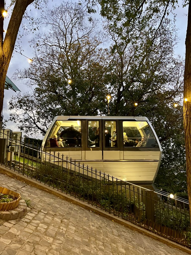 montmartre funicular climbing the hill in the evening