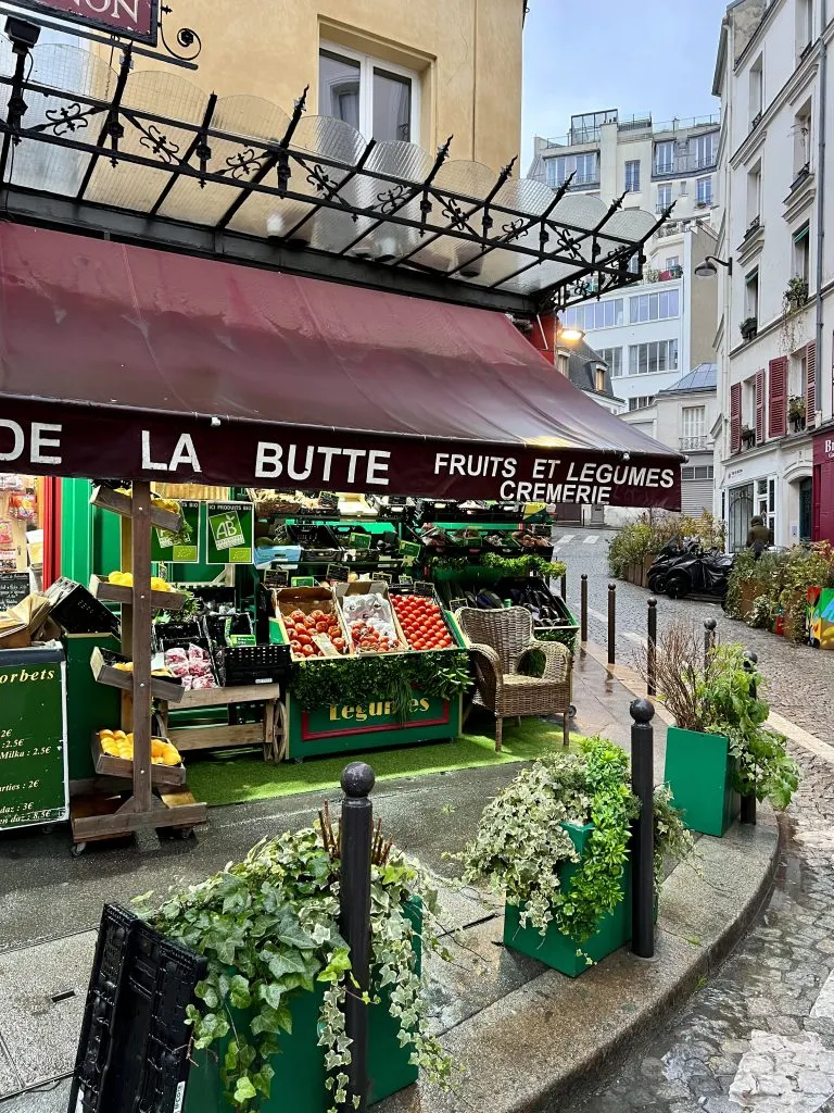 front facade of Au Marché de la Butte amelie grocery store in montmartre