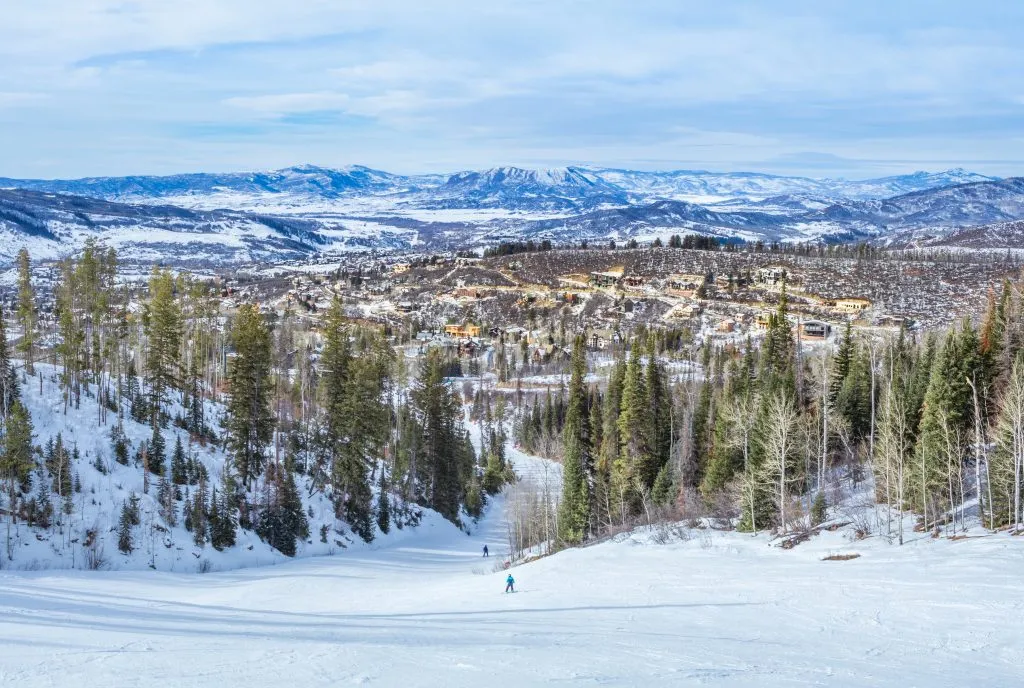 view of colorado mountain town from ski slopes in winter